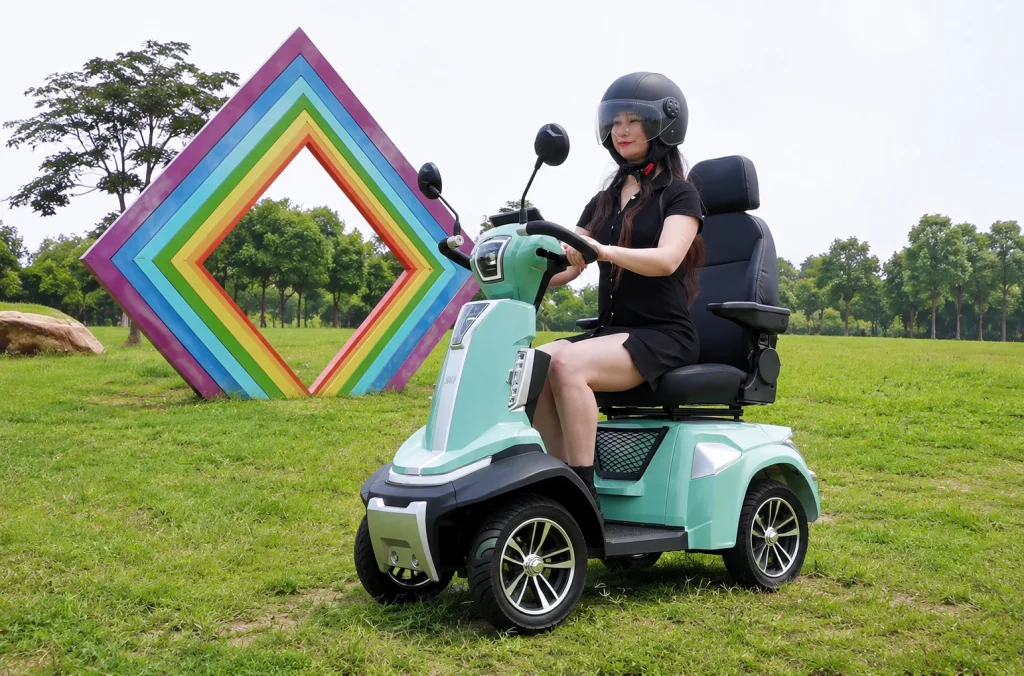 Woman riding a Spirite-3 4 wheels scooter in park